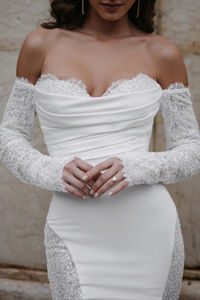 Discover the breathtaking Emelia gown by Allure Bridals, featuring sequined and beaded Chantilly lace paneling that beautifully contrasts with its draped stretch satin. This stunning wedding dress also boasts detachable off-shoulder lace sleeves, adding an extra touch of elegance and versatility. Perfect for brides seeking a combination of luxury and romance. 

#AllureBridals #EmeliaGown #ChantillyLace #DrapedSatin #LaceSleeves #ElegantBride #WeddingDress #BridalFashion #LuxuriousBridalGown 