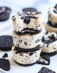 These delicious Mini Oreo Cheesecakes are made with a creamy cheesecake filling and Oreo cookie pieces. Baked in a muffin pan for the perfect dessert. Made with only 5 ingredients and takes less than 30 minutes to make! #cheesecake #minicheesecake #cheesecakebites #dessert #oreos #cookiesandcream