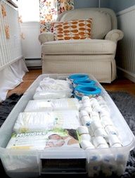 Under crib storage hidden with crib bed skirt. 9 Easy Nursery Organization Ideas | TheBump Blog