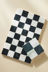 Checkmate! Crafted from marble, this deep green and white checkered marble cheese board is the perfect playing piece for displaying an assortment of cheese, fruits, and charcuterie with flair. | Josie Checkered Marble Cheese Board by Anthropologie in Black