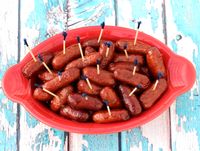 What happens when you combine Grape Jelly and Chili Sauce with Lit'l Smokies? This Crockpot Smokies Recipe and they vanish before your eyes!