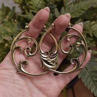 Detailed gothic ornament hoops. These earrings are for standard pierced ear lobes and also wearable perfect through tunnels and saddle spreaders. Also available in Silver. Earring wire: 1 mm Size: 55 x 65 mm Material: Brass Weights 16 gr. per piece, light weight