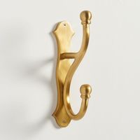 Made of cast aluminum with a rustic powder Brass or Bronze coat finish. Attaches to wall or the back of a door for coats, jackets, robes and other items. Sold individually. Made in a Fair Trade Certified(TM) factory, supporting fair and safe labor practices and empowering workers to invest in their communities. Hooks are weather coated and safe for indoor and outdoor use. Includes mounting hardware; anchors and screws. ADA-compliant design. Learn More Imported. Wipe with a soft, dry cloth.