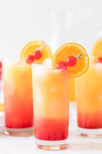 A Tequila Sunrise uses tequila, orange juice, and grenadine syrup. A beautiful cocktail that gets its name from colors combining to look like a sunrise. #tequilasunrise #tequilasunriserecipe #cocktails #summerdrinks #tequiladrinks #amandascookin