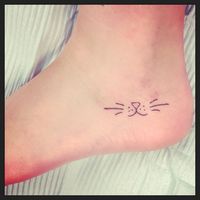 This is a cute little outline for a cat tattoo.