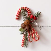 Our Candy Cane With Rusty Bells and Berries is sure to add a vintage touch to any display. 7.5" x 4.5" Plastic, Natural, Wire