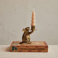 This mouse taper candleholder is a delightful addition to any room, offering a blend of playfulness and elegance. The antique gold finish gives it a vintage feel, while the mouse shape provides a unique and charming twist.