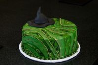 A custom "Wicked"-themed birthday cake made by a local caterer specially created for Ashley Burget, a colleague of mine who is a special person and good friend. It was worth the effort to get this done for her.