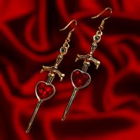 One pair of sword earrings! Earring hooks are colored stainless steel in standard size. I have 2 inch stretched ears and I'm able to wear these using other jewelry. See photos for size!