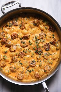 Creamy Butternut Squash Gnocchi with Sausage in a stainless steel pan