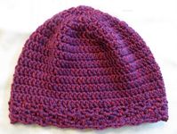 This cloche hat is expertly crocheted, beautifully textured, and can be used as a chemo cap.  Wear the hat with the bottom turned up or down around your ears and back of your neck.  Our hat is so comfortable it easily adjusts to how it is most comfortable for you.   Hat rolls up to fit easily into your pocket. Finished size 21" fits up to 23" head size. Adult Small to Medium.  Measure head at natural hair line. Crown to bottom is 8". Crochet pattern design allows for air circulation providing comfort in both warm and cool weather. This hat is made of 100 percent soft acrylic yarn and may be gently machine washed and machine dried on low setting.  As with all hand crochet and knit items, a mesh laundry bag is recommended to maintain freshness. This hat is new;  it was designed and hand croc