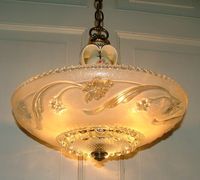 Nice. A commentor says: "For your information, this is a Porcelier chandelier and these were distributed by Harmony House (Sears). Porcelier is also a fun collectible since the company made scads of light fixtures..."