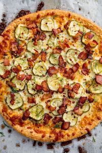 2 reviews · 30 minutes · Serves 4 · This Bacon Pickle Pizza from Delish.com is the perfect way to indulge your pickle obsession. @Delish