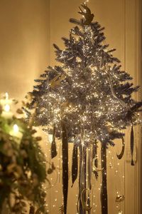 Deck the halls in nostalgic style with these shimmering tinsel strands.