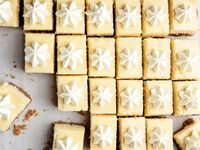 dollop of whipped cream, yellow square bars, cut in rows