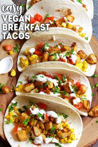 Easy Vegan Breakfast Tacos recipe made with roasted potatoes and tofu scramble. #veganbreakfast #veganrecipes #oilfreevegan via @karissasvegankitchen