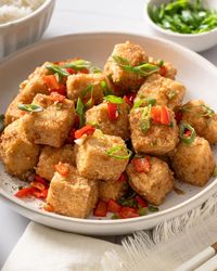 Salt and pepper tofu is a savory stir-fried Chinese dish made with firm tofu fried to golden perfection and then tossed with a salt and pepper seasoning blend that comes together in under 30 minutes.