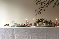 A festive table design with a green and white theme, pared with metallics and little unexpected details. Pale pink napkins, update the traditional Christmas red with a pop of orange from a scattering of clementines. The perfect setting for a winter feast and gathering.