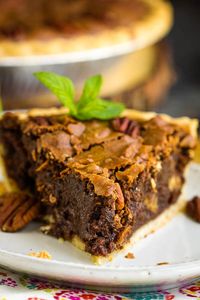 Rich, indulgent, and gooey, Chocolate Fudge Pecan Pie Recipe is quick and easy, requires no mixer, and has no corn syrup! It's a delicious new classic! #chocolate #fudge #pecan #pecanpie #chocolatepie #dessert #recipe