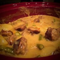 Brats, bell pepper, green beans, and potatoes are slow cooked in a creamy cheesy soup for a hearty, crowd-pleasing stew on a chilly day.