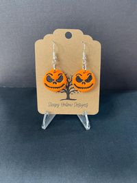 Handmade Jack Skellington polymer clay earrings. The perfect earrings to add a pop to your Halloween outfit and sure to make a statement piece.   Since each pair is handmade, no two earrings will ever be the same. They are super lightweight. Choose either a silver or gold wire color finish.   CARE INSTRUCTIONS: Polymer clay is durable, but not indestructible!  -Do not wear while swimming, showering and avoid dropping them.