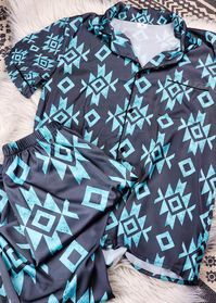 Unleash your inner cowgirl with our Black & Turquoise Aztec Silky Pajamas. With a touch of western flair, these pajamas will have you sleeping well and feeling stylish all night long. Comfortable and chic, these pajamas are a must-have for any cowgirl's wardrobe. 97% polyester and 3% spandex - silky soft Loose fit Elastic waist Button Top True to size, size up if you prefer more room Model is wearing a Small, 125lb, 5'3" Size chart in photos See delivery chart for estimated arrival time