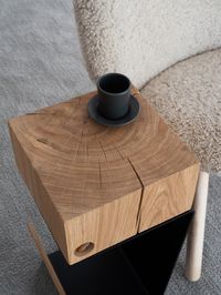 "This minimalist and unique side table is the perfect addition to any modern or contemporary space. Made from solid oak and metal, giving it both durability and style. The \"ACORN\" modern table is not only an extra piece of furniture for your favorite book, magazines, lamp stand but is also an exclusive element of decor. Invest in this beautiful side/coffe table and bring a touch of warmth and style to your living space. Each table in the corner has a real acorn. Materials : Solid oak and metal