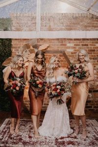 Rust married terracotta, copper and burnt sienna floral arrangements bridesmaid dresses Burnt orange wedding theme Terracotta wedding bridesmaid dresses Orange wedding centrepieces Copper saree Orange dress outfit wedding orange wedding ideas