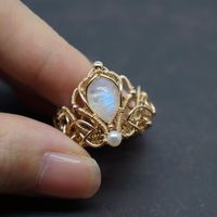 Very elaborate and ornate Victorian court ring. Made of moonstone, pearl and 14k gold filled wire.  It's a wonderful handmade craft.  Express your love and give her the best ring. It also can be a perfect gift for yourself or your friends. -------------------------- D E T A I L S * The natural stone comes from Indian * Other materials are 100% Top quality 14k gold filled from USA * Perfect for someone with sensitive skin ❤  * Each piece of jewelry is handmade with love and care ❤  * Comes in a branded gift box   -------------------------- 1 4 K  G O L D  F I L L E D  * Gold filled jewelry can last a lifetime if it is cared for properly * It is made with a thick layer of 14k gold on top of another metal, but this layer contains almost 100% more real gold than gold plated jewellery which mak