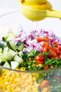 Bright and colorful cucumber, red onion, sweet corn, cherry tomatoes, and feta cheese make up this refreshing corn salad. Perfect for backyard barbecues and cookouts and is made in a snap!