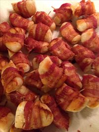 Bacon wrapped perogies. Bite size Cheemo, use frozen. Cut a pack of bacon in half and wrap each perogy in a 1/2 strip of bacon. Bake at 450F on parchment lined baking sheet. Turn over half way and bake until bacon is cooked. About 20-30 minutes. Serve with chive and dill sour cream. Epicure's 3 onion and lemon dilly dips work great with the sour cream.