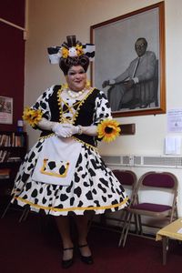 Richard Aucott as Pantomime Dame in Jack and the Beanstalk - Dame Trott - at the Eric Morecambe theatre in Harpenden December 2013 photograph taken during the press launch with a portrait of Eric Morecambe behind