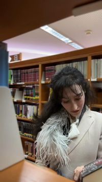 ♡ Veronika Lipar fashion editor Brunette from Wall Street #library #dateidea #selflove #metime #dateoutfit #boujeewinteroutfit #motoboho #winteroutfit #coat #featherscarf #feathers #miniskirt #combatboors #tweedjacket #preppy #cutewinteroutfit