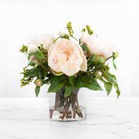 This gorgeous pink faux peony arrangement is an elegant accent piece providing the perfect pop of color! Style this arrangement within a room by placing on a nightstand, side table, entry table or use as a centerpiece on a coffee table or small dining table. #peonyarrangement #luxuryhomedecor #floralhomedecor #silkflowerarrangement #peonies #interiordesign