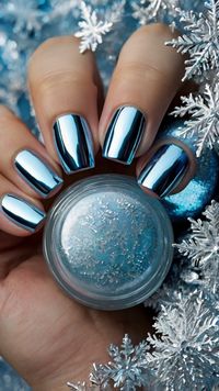 “Stay on trend with shiny, frosty chrome nails in silver and icy blue. These nails are a show-stopper at every holiday event. Save this pin for stunning nail inspiration! 💎❄️ #WinterGlam #HolidayNails2024 #IcyBlueChrome”