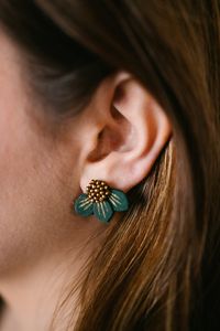 These beautiful emerald green & gold hand-painted, hand-beaded earrings are artisan made in India. These floral studs are a work of art and a luxury to have in your jewelry box. Details: -Approx. 3/4" -Handmade: hand cut fabric, hand painted, hand-beaded -Artisan made in Kerala, India -Care card included