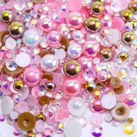 PRICES MAY VARY. 💖 You Will Recieve: A bag of beautiful mixture of flatback half pearls and flatback rhinestones, in an assortment of sizes 2mm-10mm, totally about 60 grams, around 3620pcs. Besides, it includes a wax pen and tweezers for you to easy pick up the pearls and rhinestones. 🎀 Assortment Sizes: The flatback half pearls come in a mixture of colors and sizes of 2/3/4/6/8/10mm. The flatback rhinestones are resin rhinestones in sizes of 2/3/4/5/6mm. These mixes are such a great way to get an assortment of colors and sizes without having to buy each item individually. 🎀 Shiny Materials: The flatback rhinestones are made of resin instead of glass. The Half pearls are made of ABS with a smooth and shiny surface. They are light and have better performance on bright color and make your