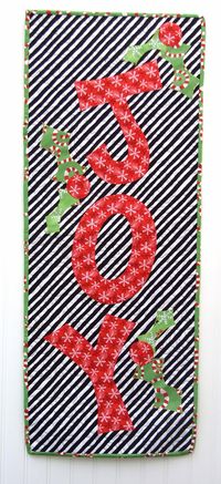 Get in the Christmas spirit by creating a simply adorable wallhanging that celebrates the holiday season with this Joyful Noise Holiday Wallhanging. This easy applique pattern shows you how to create this quick quilting project and even comes with fr