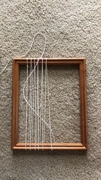 Weaving on a picture frame! Most people have one or two of these lying around. You can easily set one up to weave a tiny tapestry. This short vid shows you how to warp it (wind the string) and start weaving. I use a thick tapestry needle, cotton yarn/string for warping, chunky yarn for weaving, and a fork for packing down the rows nice and tight. ✨ .