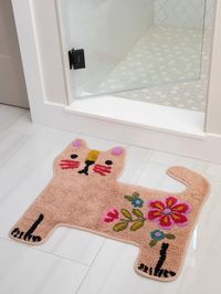 Our Tufted Cotton Bath Mats come in the cutest shapes and colors to brighten up your bathroom! Made from 100% cotton, our bath mats are so soft with a fluffy, shaggy feel - and they have a non-skid back! We love their adorable designs like this rose-colored, cat-shaped mat that looks great in front of your bathroom sin