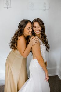 Maid of Honor and bride share a moment