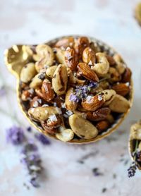 These salted honey lavender nuts are the best snack to make for when you're on the go or when you need a perfect appetizer for your dinner party. Roasted, sweet and salty with a hint of lavender makes these irresistible! I howsweeteats.com #honeylavendernuts #appetizers