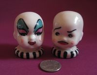 "Please allow 2-3 weeks for delivery! Baby Divine and John Waters! Here's a very unique Salt and Pepper shaker for your kitchen! Bizarre?... YES!! These two babies will liven up your kitchen and kitsch collection. The set is made of porcelain, hand painted with an underglaze paint and then hand glazed with a clear fired finish. Each set is signed, dated and marked as an original. Each baby head measures approximately 2 1/4\" H x 1 3/4 W and has a natural cork stopper."