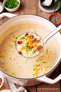 This evaporated milk potato soup is smooth, creamy, and loaded with deliciousness. The easy recipe is quick and easy to make with a few simple ingredients. The soup tastes just like a loaded baked potato and can only be described as comfort food in a bowl. It's loaded up with your favorite toppings, like cheddar, bacon, sour cream, and green onions and embodies everything you love about baked potatoes. Canned evaporated milk makes the soup rich without being too heavy. | CountryHillCottage.com