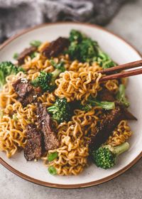 This fast and easy Beef and Broccoli Ramen Noodle Stir-Fry takes less than 30 minutes and is as satisfying as any takeout dish. It's also easy to customize - try different vegetables or tofu or chicken for the steak. #ramen #noodlebowl #stirfry #easydinner #easyrecipe #easymeal 