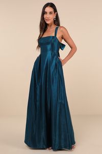 Effortlessly fabulous is exactly what comes to mind when we see a look like the Lulus Immaculate Aura Shiny Dark Teal Taffeta Maxi Dress With Pockets! Sturdy woven taffeta, with a sleek sheen throughout, shapes this gorgeous gown that features a sleeveless bodice with a trendy under-bust seam and a simple straight neckline, all supported by slender, adjustable shoulder straps. The fit-and-flare-inspired silhouette boasts pleated details at the waist and an A-line skirt with convenient side seam