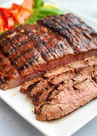 Grilled Chili Lime Flank Steak! This grilled flank steak is seasoned with the smoky flavors of chili powder, paprika, and cumin. Combined with the sweetness of honey and a zip of lime juice, this flank steak is flavorful, but without covering the tender, meatiness of the cut. #grilling #flanksteak #simplyrecipes #steakmarinade