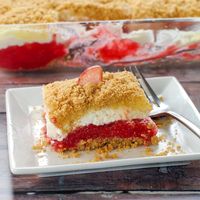 This easy, no bake, Rhubarb Dessert has a graham cracker crust and layers of vanilla pudding, whipped cream mixed with marshmallow and a delicious rhubarb filling.