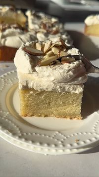 Almond Cake being cut with a spoon