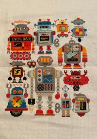 Robot cross stitch piece ready to ship! Bright colours perfect to brighten up any room or space!